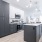 1 Bedroom Apartments in Oklahoma City, OK - Muse - Kitchen Featuring Island With Sink, Stainless Steel Appliances, And High Ceilings