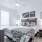 One Bedroom Apartments in Oklahoma City, OK - Muse - Bedroom Featuring Ceiling Fan, Wood-Style Flooring, And Chic Furniture